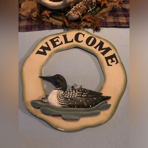 Welcome sign with ducks